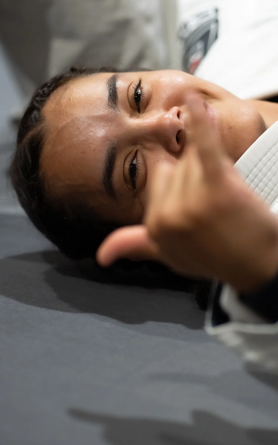A Brazilian Jiu-Jitsu student training from the ground at Fúria Fight Club